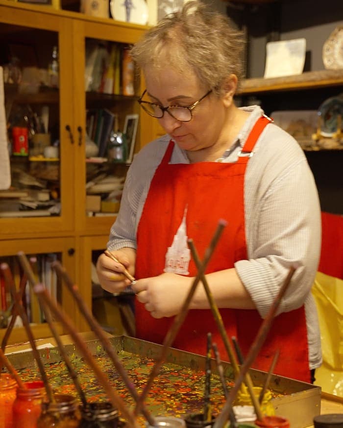 Nesime Kantar at her tray in her Galata workshop, stylus in hand