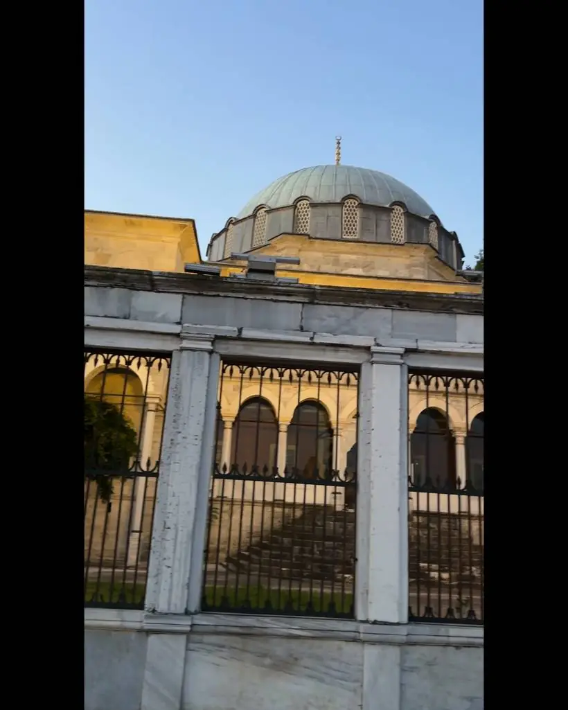 The mosque dome in evening light, beside the fishing spot